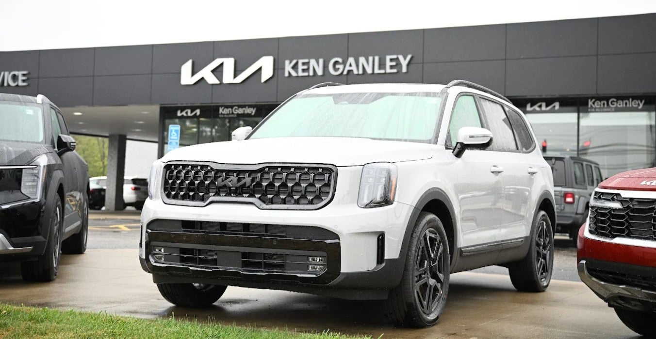 Kia in Front of Ken Ganley Kia Alliance Dealership